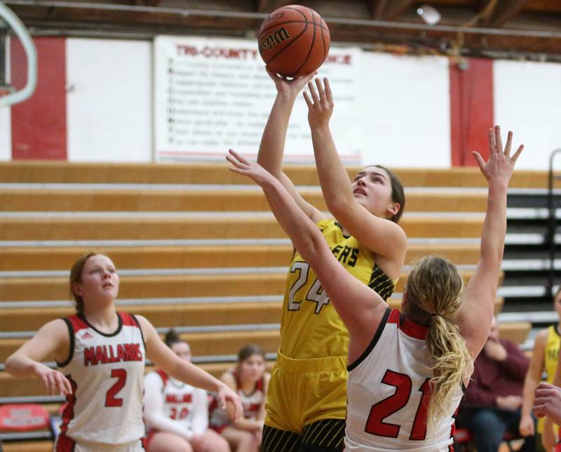 Purtnam County's Maggie Richetta eyes the hoop while being guarded by Henry-Senachwine's Brooklynn Thompson on Monday, Dec. 18, 2023 in Henry.