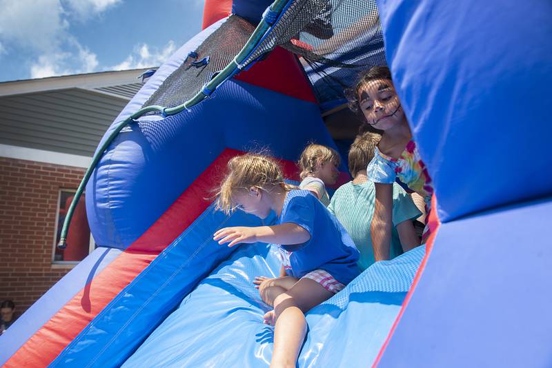 A bounce house was brought to Coloma Homes for the summer fun day on Thursday. Face painting, snacks and popsicles were also made available to the residents.