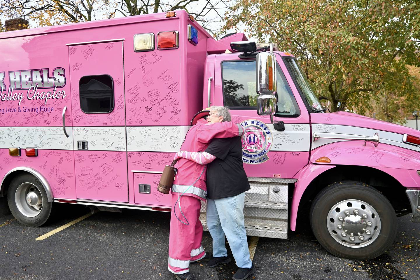 Sauk Valley Chapter Pink Heals President Brian Tribley hugs Liz Svadbik, of Princeton, after she told him she was cancer free for ten years during Oct. 25 event.