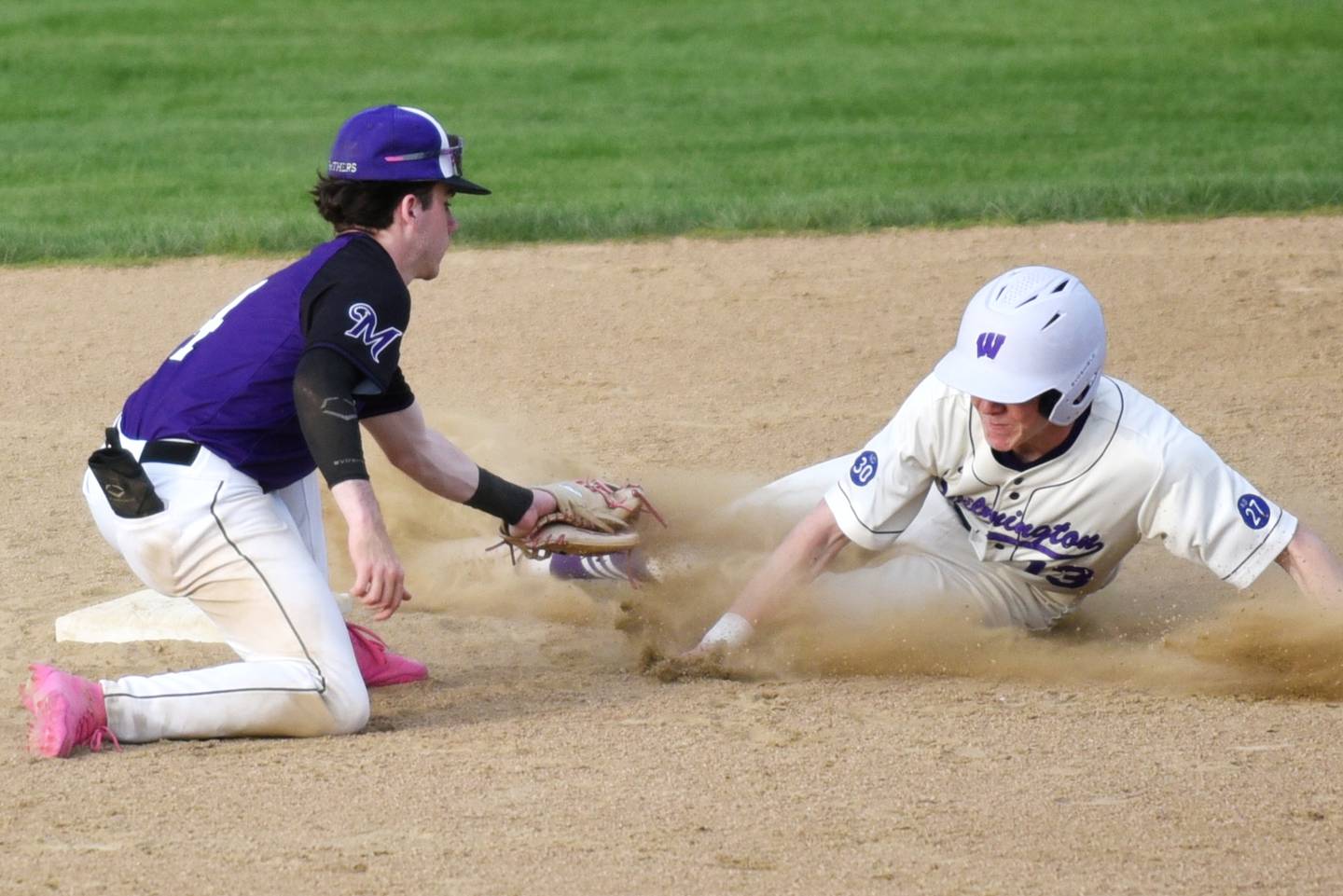 Wilmington's Dane Van Duyne, right, is tagged out at second base by Manteno's Tyler Buehler during a game at Wilmington Tuesday, April 21, 2026.