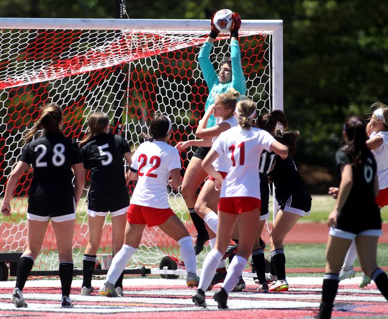 Fenwick goal keeper Audrey Hinrichs (31) makes a save during an IHSA Class 2A state semifinal game against Triad at North Central College in Naperville on Friday, June 3, 2022.