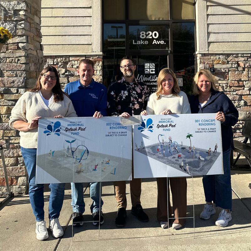 Community Foundation of McHenry County Director of Philanthropy Jessica Rizza presents a grant check for the Melissa O'Leary Splash Pad project
