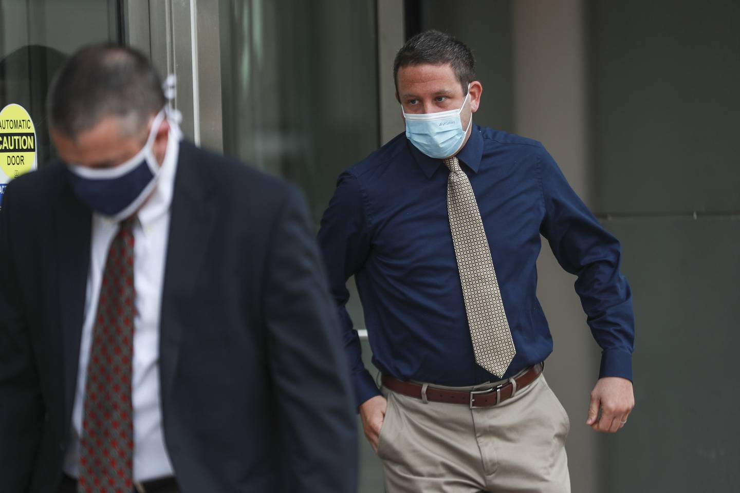 Jeremy Hylka (right) leaves the courthouse after his arraignment on Thursday, June 24, 2021, at Will County Court House in Joliet, Ill.