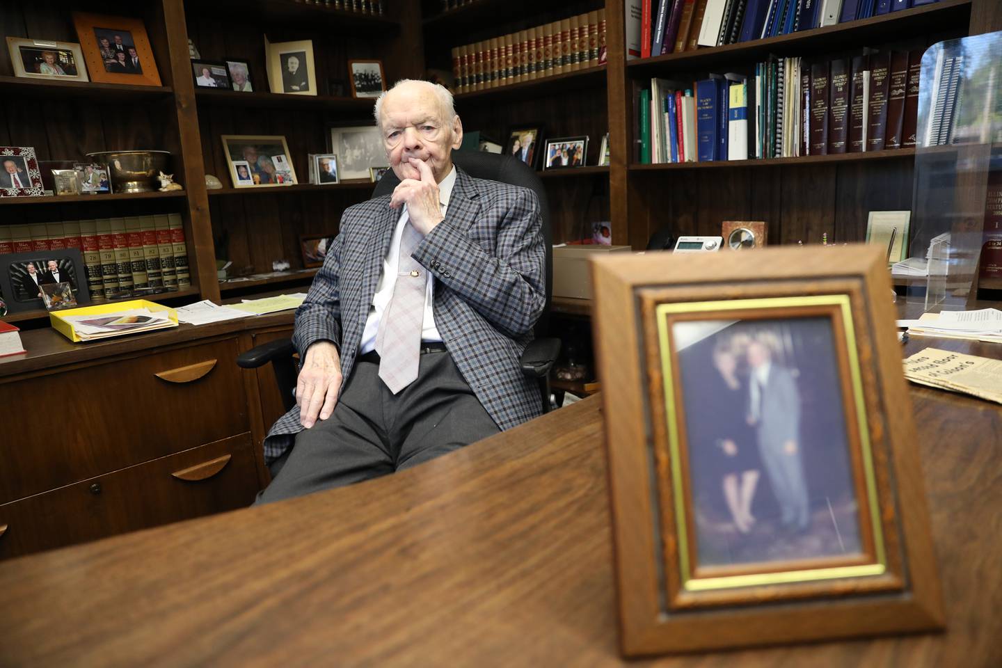 Robert Gorecki, with a photo of himself and late wife Janet, served in the Army during the Korean War and is a St. Charles attorney.