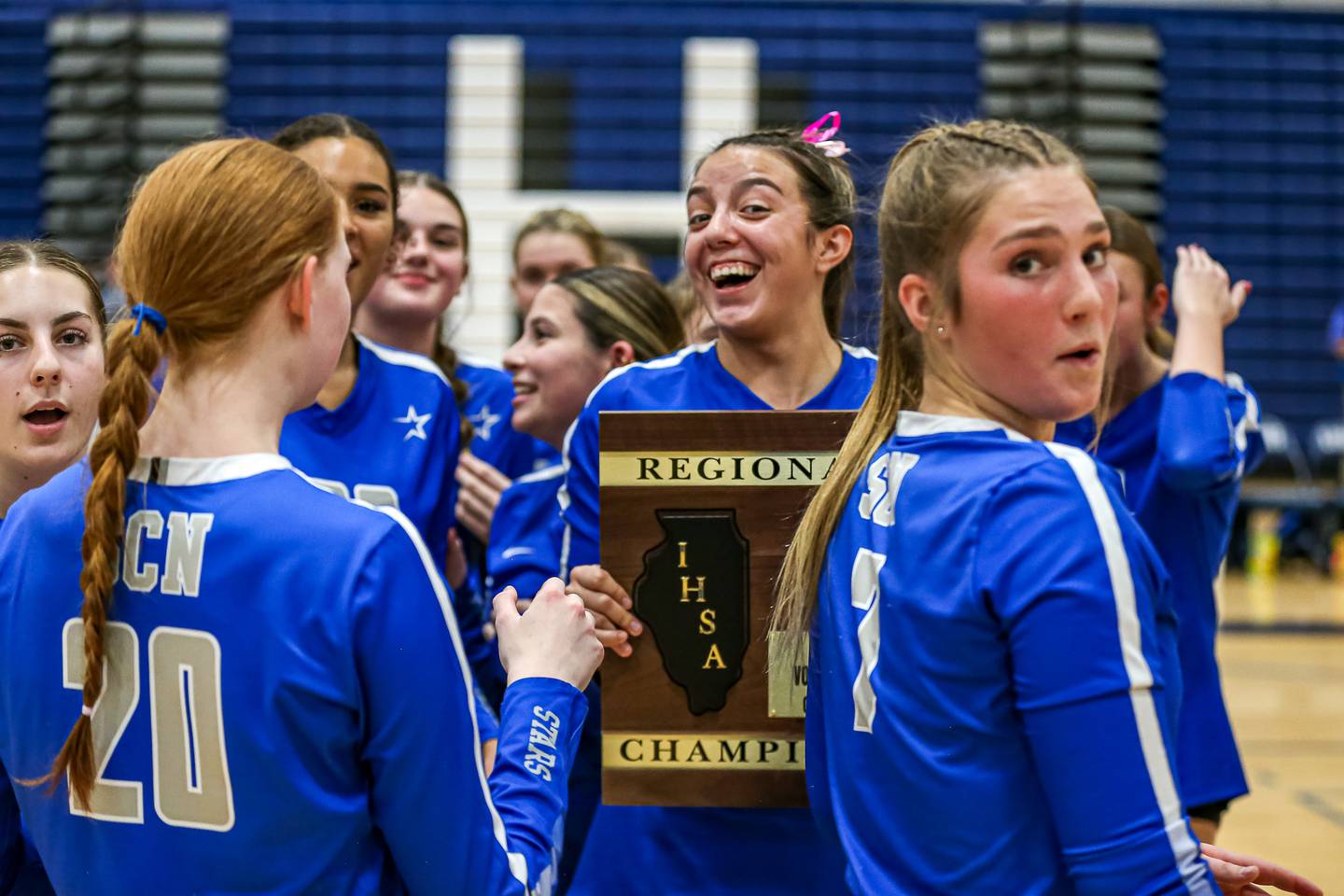 St. Charles North's Haley Burgdorf (23) celebrates with teammates after defeating Wheaton North for the Class 4A Lake Park Regional final volleyball title.  Oct 31, 2024  in Roselle.
