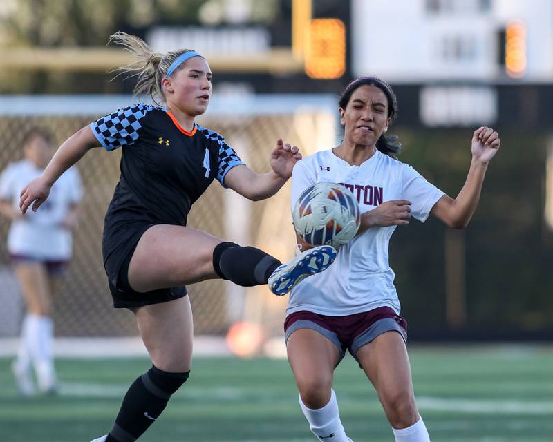 Willowbrook's Lillian Macias (4) kicks the ball away from Morton's Isabel Sanchez (4) during soccer match between Morton at Willowbrook.  April 15, 2024.