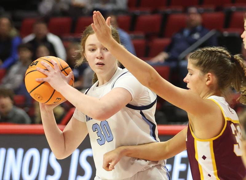 Nazareth's Hillary Whorlow looks to pass around Loyola's Sophia Calhoun during the Class 4A State girls basketball championship game on Saturday, March 7, 2026 at CEFCU Arena in Normal.