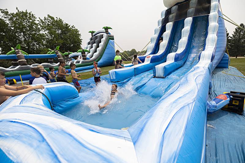 Two big inflatable water slides were set up Thursday, June 15, 2023 for the SPARK campers to enjoy.