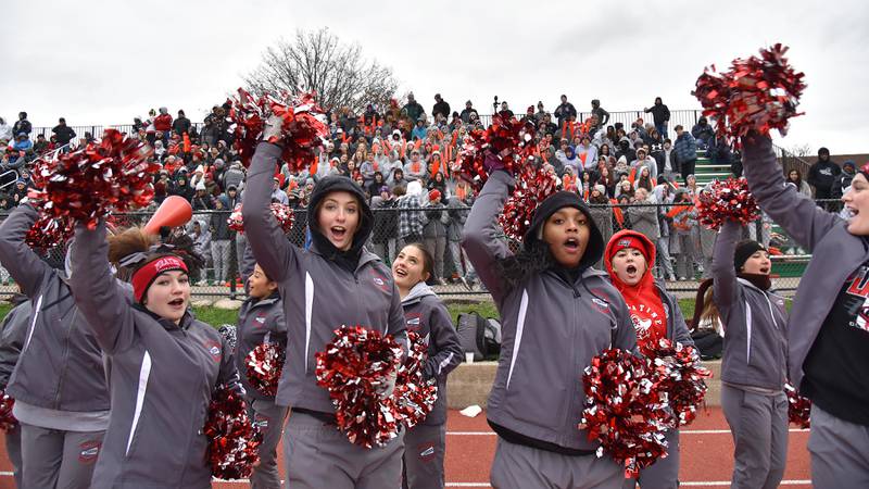 Palatine cheerleaders encourage the crowd in a Class 8A quarterfinal playoff football game in Elmhurst on Saturday, November 12, 2022.