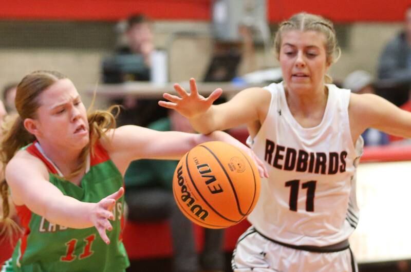L-P's Elizabeth Sines looses control of the ball as Metamora's Gillian Tyra looks to pick it up during the Ottawa Girls Holiday Tournament on Monday, Dec. 16, 2024 in Kingman Gym at Ottawa High School.