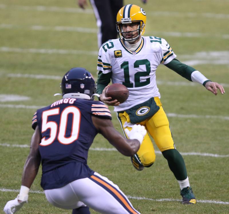 Chicago Bears outside linebacker Barkevious Mingo (50) squares up to tackle Green Bay Packers quarterback Aaron Rodgers (12) during their game Sunday at Soldier Field in Chicago.
