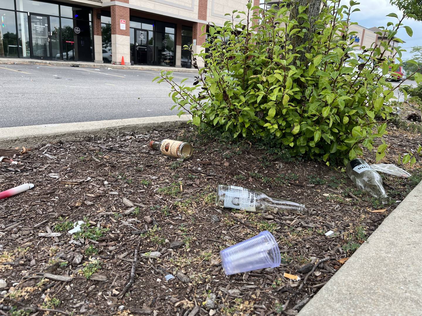 Bottles of beer, liquor and empty plastic cups on a concrete planter at the parking lot of Forza Table & Tap, 1827 Knapp St., Crest Hill, seen on Monday, July 11, 2022.