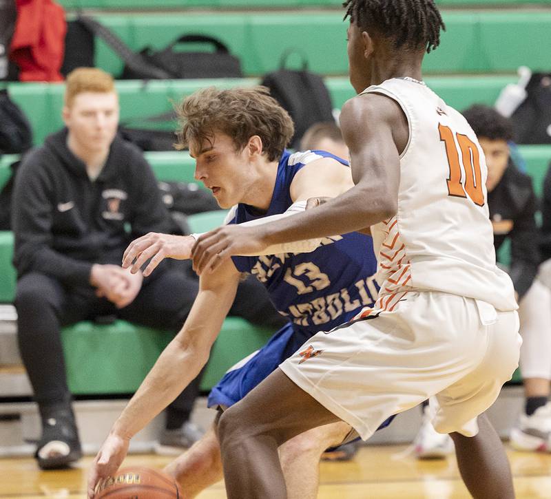 Newman’s Nolan Britt dribbles against Winnebago’s Myles Smith Saturday, Jan. 7, 2023 at the Rock Falls Shootout.