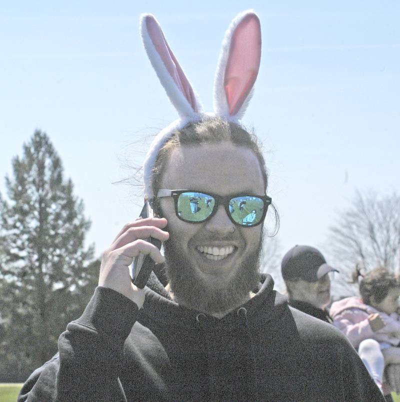 Branden Gordon takes time out for a phone call Saturday, April 12, 2025, at the Eggstravaganza Egg Hunt, sponsored by the Dixon Park District.