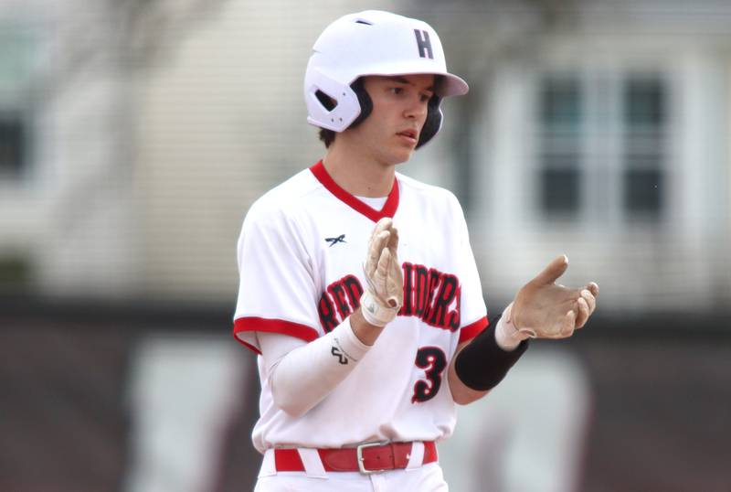 Huntley’s Griffin Goldstein celebrates a single against Jacobs in varsity baseball Wednesday at Huntley.