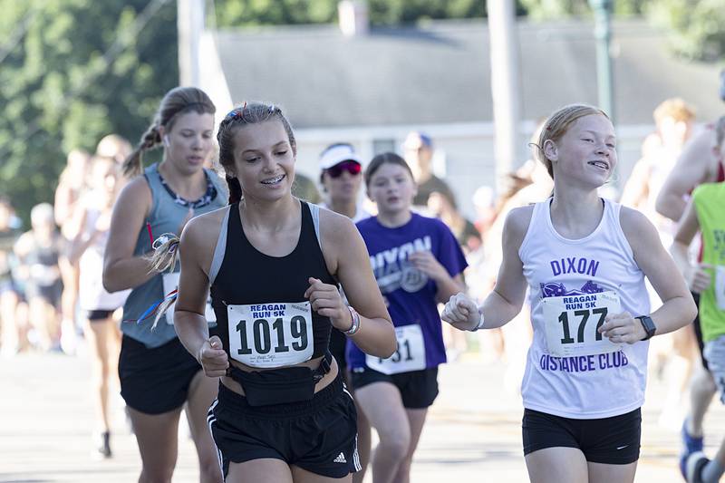 Cheers and bells push the runners Saturday, July 6, 2024 during the Reagan Run.