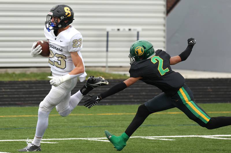 Sycamore's Dylan Hodges gets by Westinghouse's Justis Watts on his way to the end zone Saturday, Nov. 9, 2024 during their Class 5A second-round playoff game at Knute Rockne Stadium in Chicago.