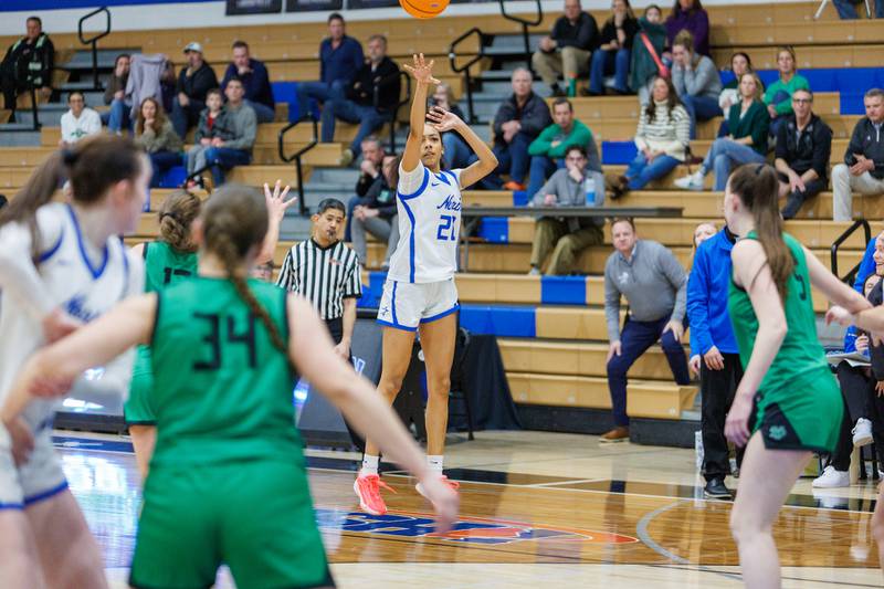 St. Charles North's Sydney Johnson shoots a three pointer against York at the Class 4A Regional Final on Thursday, Feb.19,2026 in St. Charles.