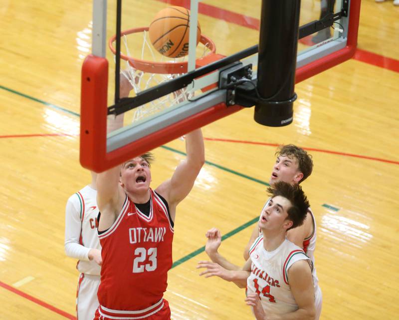 Ottawa's Owen Sanders dunks the ball over L-P's Wyatt Kilday during the Class 3A Regional title game on Wednesday, Feb. 25, 2026 in Sellett Gymnasium at L-P High School.