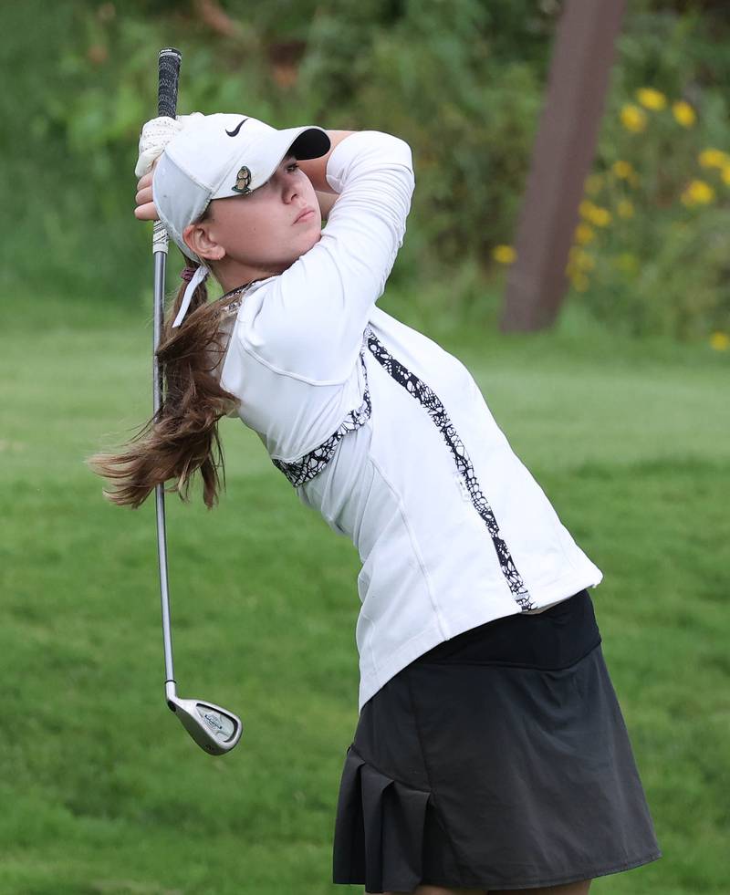 Sycamore-DeKalb co-op’s Simone Bertrand hits her tee shot on the par three tenth hole Thursday, Sept. 28, 2023, during the Class 2A girls golf regional at Sycamore Golf Club in Sycamore.