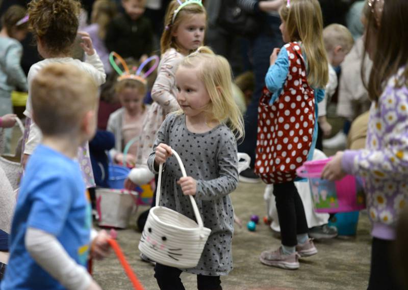 Children including Brooklyn Sumpler of Downers Grove participate in the Downers Grove Bunny Hop Egg Hunt Friday, March 22, 2024.
