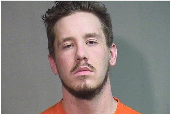 Woodstock man who had armor, loaded machine gun when arrested pleads guilty to weapon, drug charges