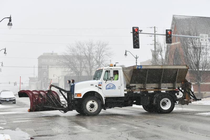 A snowplow travels along South Indiana Avenue Tuesday, Feb. 12, as snow arrived to the Kankakee area.