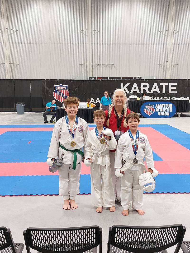 Three Marengo boys competed in the he AAU Junior Olympic Games from July 27 to July 30, 2023, in Des Moines, Iowa. From left, Elijah Lindner, 10; Lincoln Jerominski, 10; Sensei Kim Bauman (in red); and Levi Jerominski, 8.
