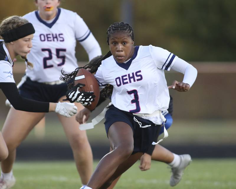Oswego East's Avaya Kittling-turner (3) runs away from the defense during Oswego East Regional Final flag football game between St. Charles North at Oswego East Thursday, Oct 9, 2025 in Oswego.