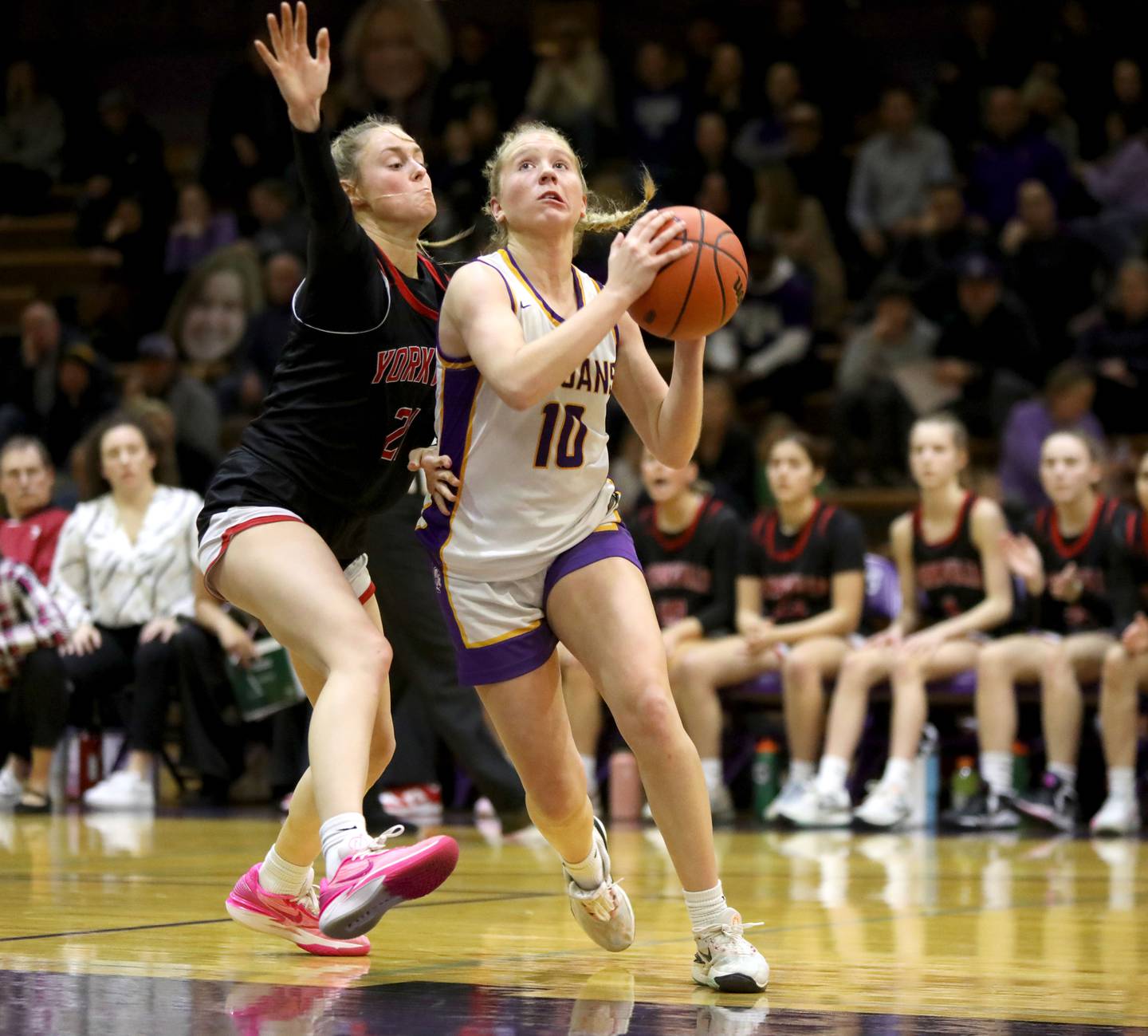 Downers Grove North’s Hope Sebek goes up for a layup against Yorkville’s Kenxie Sweeney during the Class 4A Downers Grove North Regional final on Thursday, Feb. 15, 2024.