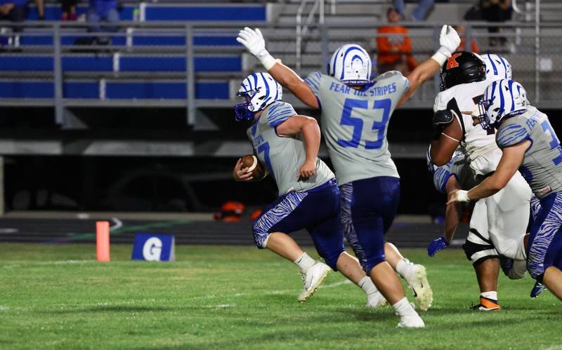 Princeton senior linemen Grady Cox scoops and scores on a fumble in the second quarter of Friday's game at Bryant Field. The Tigers beat Kewanee 63-12.