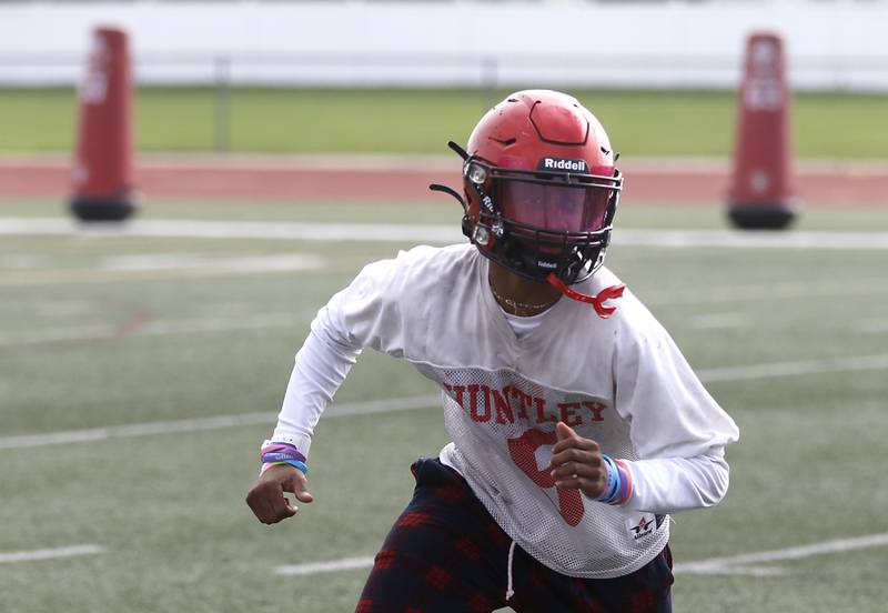 Huntley's Bryce Walker runs pass patterduring the first day of football practice Monday, August 7, 2023, at the Huntley High School’s Red Raider Stadium.
