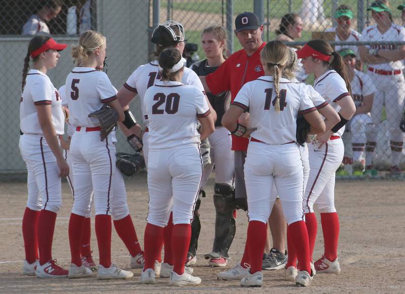 Ottawa head softball coach Adam Lewis  talks to his team while playing L-P on Friday, April 14, 2023 at Ottawa High School.