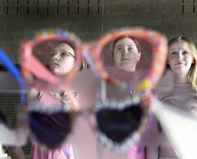 Zoey Sterner, Lydia Cliff and Sophia Sibert stand at the ready for customers at their Mini Divas booth on Wednesday, April 16, 2025, that sold costume jewelry and sunglasses during the Central Intermediate School Lemonade Day My Way an after-school program where students learned about different aspects of starting a business