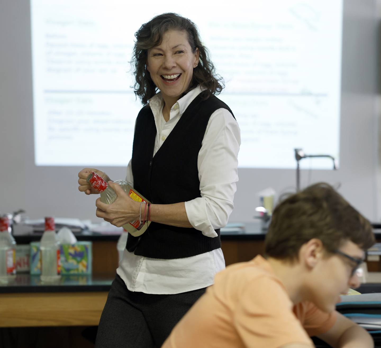 Science teacher Amy Schwartz works with her eighth-grade students at Edison Middle School in Wheaton.