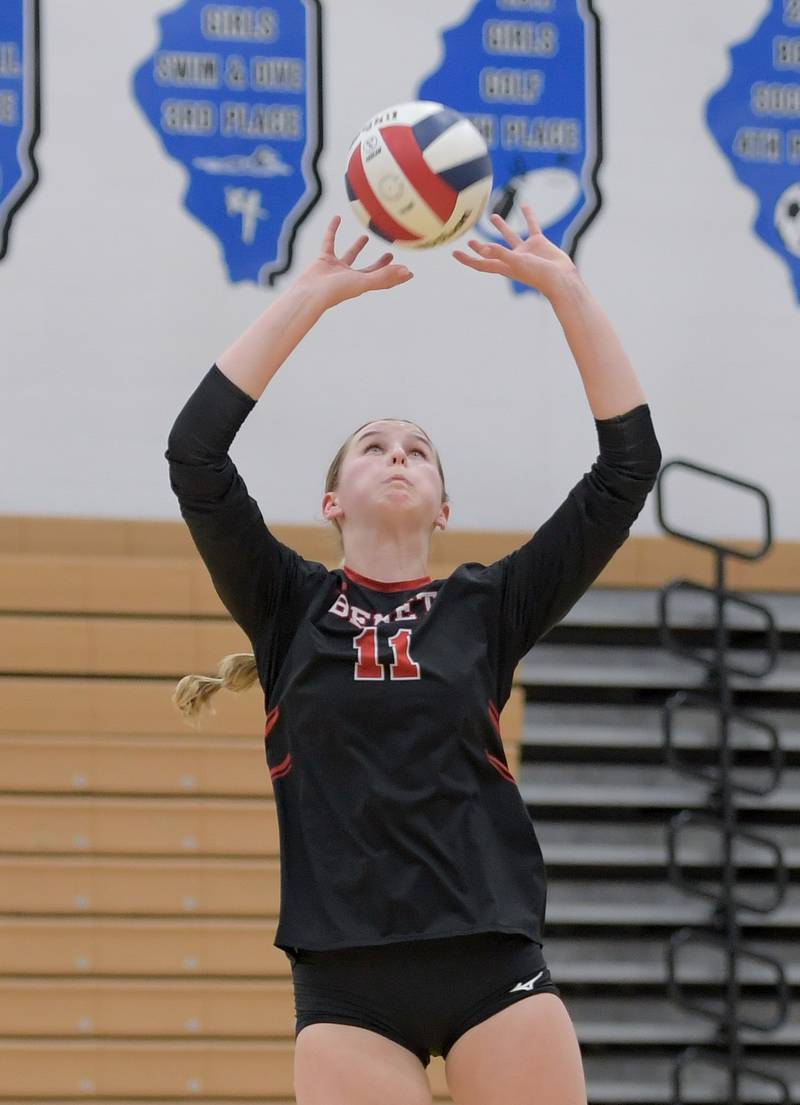 Benet’s Ellie Stiernagle (11) sets the ball against the St. Charles North during a game on Wednesday, September 20, 2023.