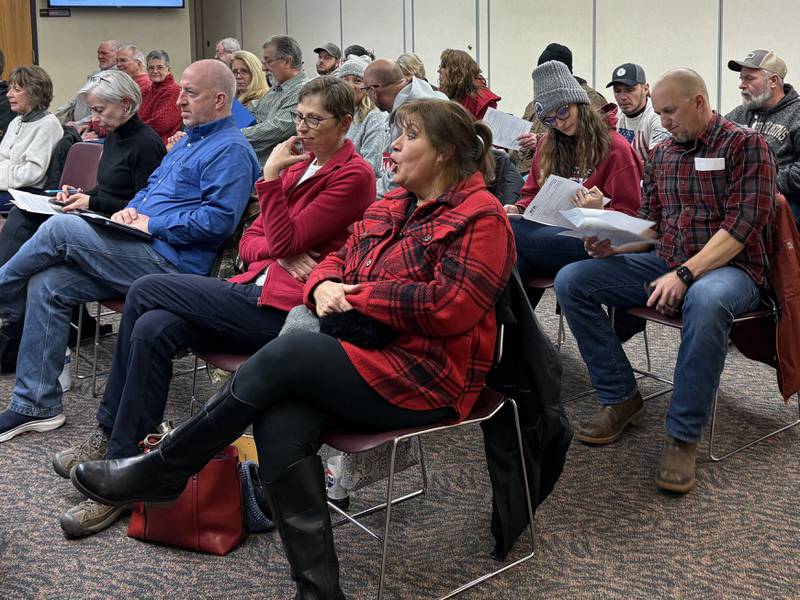 Opponents of a proposed ready-mix plant near Marengo listen during the McHenry County Board meeting Tuesday, Jan. 21, 2025.