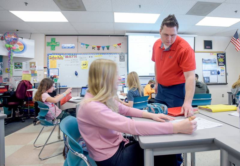 Patrick McGuire leads a seventh grade social studies class at Wredling Middle School on Tuesday, March 15, 2022.