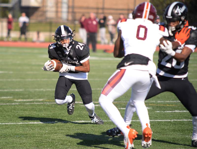 Fenwick's Myles Montgomery gets past  Brother Rice's defense during their playoff game Saturday, Nov. 2, 2024.