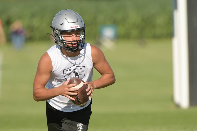 Kaneland’s quarterback Troyer Carlson sets back for the pass during a 7 on 7 football against Oswego in Maple Park on Tuesday, July 12, 2022.