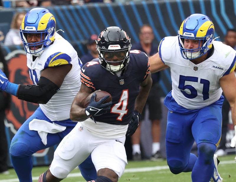 Chicago Bears running back D'Andre Swift breaks through the Los Angeles Rams defensive line during their game Sunday, Sept. 29, 2024, at Soldier Field in Chicago.