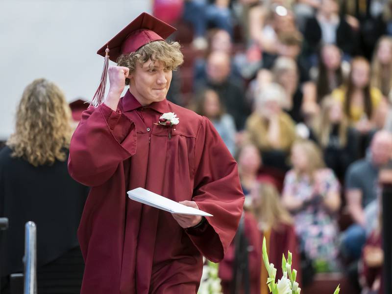 Graduating senior Hayden Freund celebrates after receiving his diploma during a graduation ceremony for the class of 2022 on Sunday, May 22, 2022, at Richmond-Burton Community High School in Richmond.