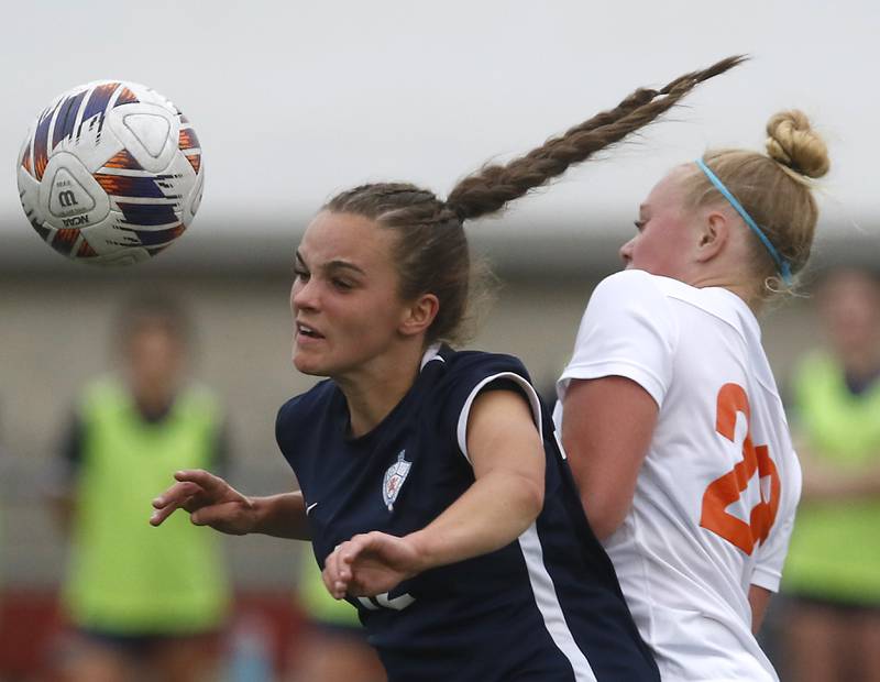 St. Viator's Lilly Konopka heads the ball away from Crystal Lake Central's Allison Barnett during the IHSA Class 2A Deerfield Sectional championship girls soccer match on Friday, May 30, 2025, at Deerfield High School.
