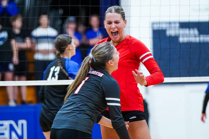 Aurora Christian's Hope Wagner (right), celebrates with  Ashlyn Aseltine (1) after scoring a point against Newark during a non-conference match at Newark High School on Tuesday, Sept. 9, 2025.