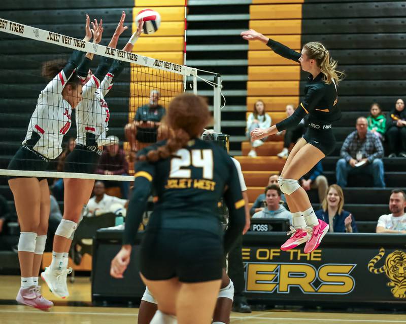Joliet West's Ava Grevengoed (1) spikes the ball during regional final volleyball match between Bolingbrook at Joliet West.  Oct 26, 2023.