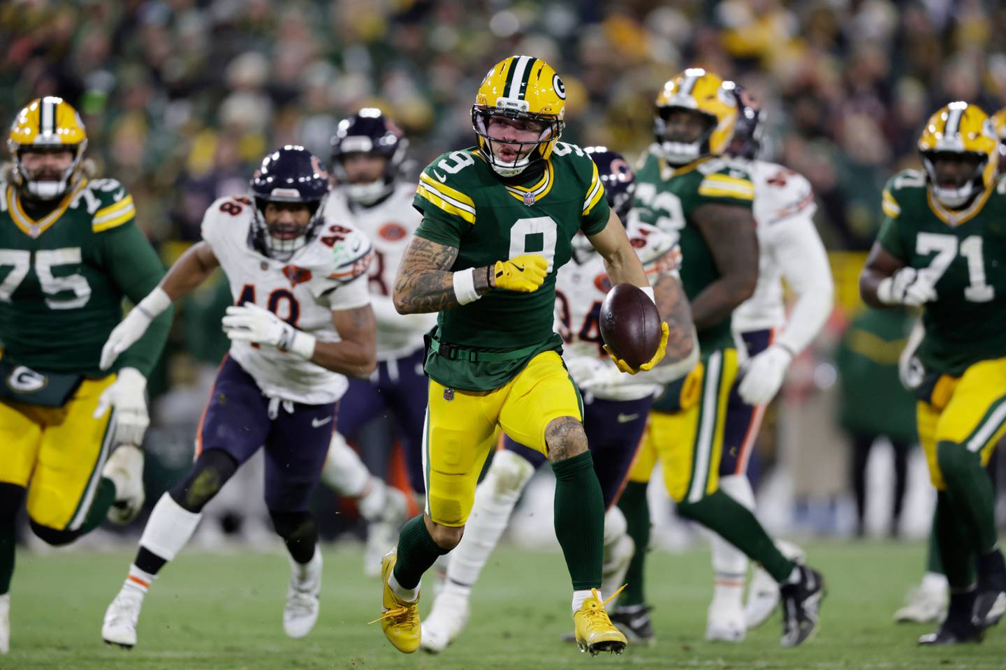 Green Bay Packers wide receiver Christian Watson (9) runs for a touchdown against the Chicago Bears during the second half of an NFL football game Sunday, Dec. 7, 2025, in Green Bay, Wis. (AP Photo/Matt Ludtke)