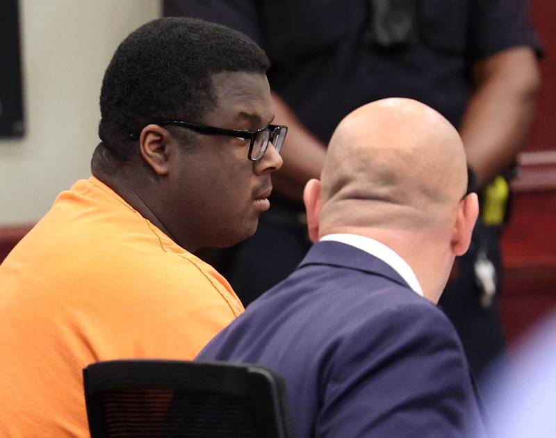 Timothy Doll, (left) who pleaded guilty to murdering DeKalb High School freshman Gracie Sasso-Cleveland in 2023, talks to his attorney Andrew Nickel Thursday, Aug. 14, 2025, during his sentencing hearing at the DeKalb County Courthouse in Sycamore. Doll was sentenced to 52 years in prison.