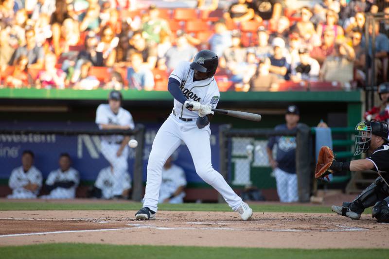 Left fielder Cornelius Randolph swings at a pitch during a game against the Milwaukee Milkmen at Northwestern Medicine Field on Friday, July 29, 2022.