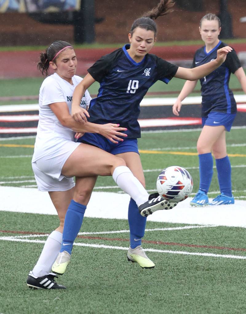 Burlington Central's Mia Kerr (right) tries to hold off Peoria Notre Dame's Maddie Stickelmaier during their third place game Saturday, June 1, 2024, at the IHSA Class 2A state soccer finals at North Central College in Naperville.