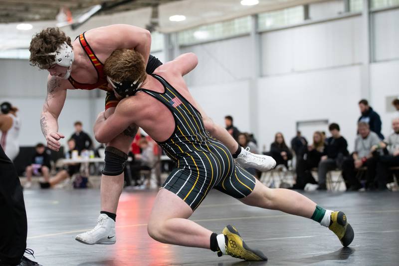 Reed Custer's Dominic Alaimo, right, and Tinley Park's Sebastian Sanderson wrestle in the 215-pound championship match during the Reed-Custer Comet Classic Wrestling Invite on Saturday, Jan 17.